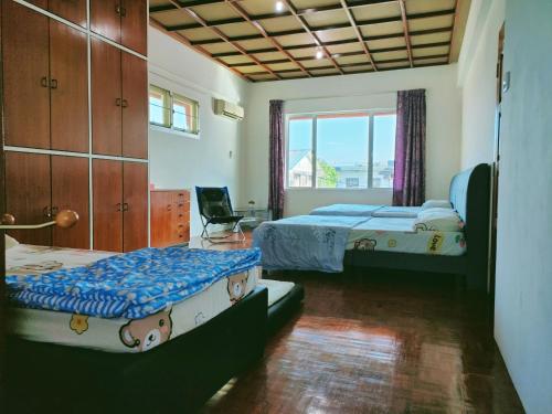 Postel nebo postele na pokoji v ubytování ANNA HOMESTAY SIBU