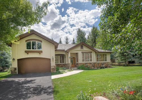a house with a garage in a yard at 44 Aspen Meadow Drive in Edwards