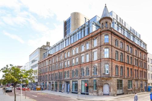 an old brick building on a city street at Student-Only Accommodations in Belfast in Belfast