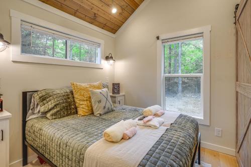 a bedroom with a bed with stuffed animals on it at Monteagle Cabin with Swim Spa, Sauna and Fire Pit! in Monteagle