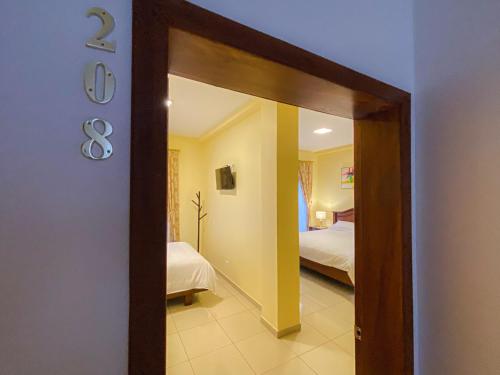 Postel nebo postele na pokoji v ubytování Gran Hotel REX
