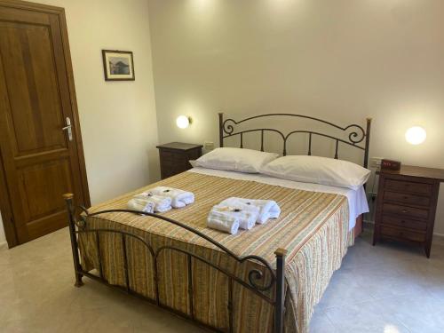 a bedroom with a bed with two towels on it at Casa Isa in Narni Scalo