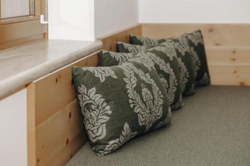 a row of pillows sitting next to a counter at Hubertus - Das Landhaus in Kleinarl