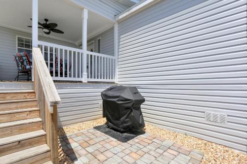 a black trash bag sitting on a porch of a house at Salty Breeze by Pristine Property Vacation Rentals in Saint Joe Beach