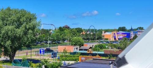 a view of a park from a building at Maison Rose Plopsaland in De Panne