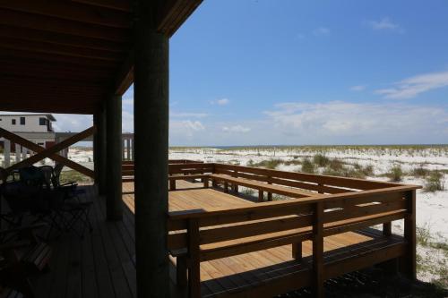 a porch of a house with a view of the beach at One More Time Again by Pristine Properties Vacation Rentals in Mexico Beach