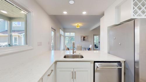 a white kitchen with a sink and a window at 7645 Huntington Villa in Hilton Head Island