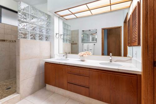 a bathroom with a sink and a shower at The Shores at Waikoloa 231 in Waikoloa