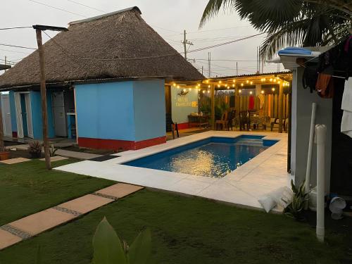 a house with a swimming pool in a yard at Bedrooms where Charlie in El Paredón Buena Vista