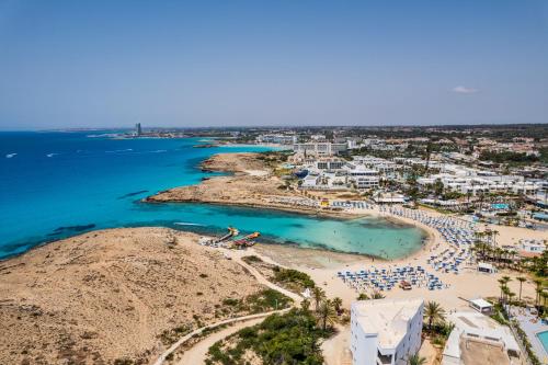 an aerial view of a beach and the ocean at Kritamo Beach Hotel Apartments in Ayia Napa