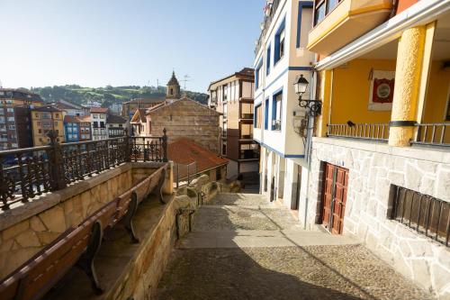 a view of a city street from a balcony at Torrontero con vistas al mar in Bermeo