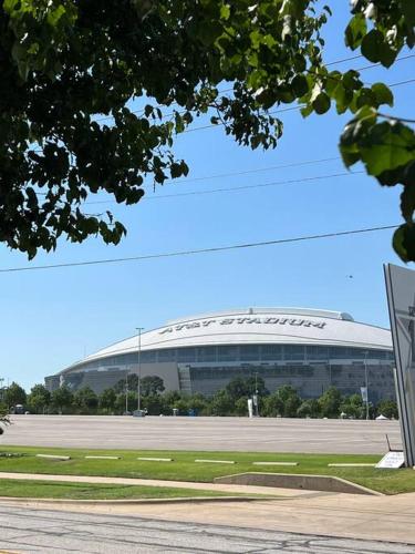 a large building with a dome on top of it at Lovely 2-bedroom condo next to AT&T Stadium in Arlington