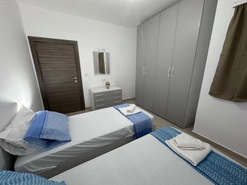 Postel nebo postele na pokoji v ubytování APT Oasi Urbana