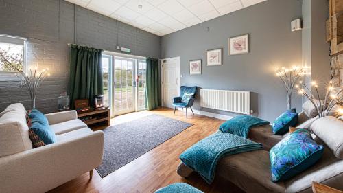 a living room with a couch and a table at The Atholl Palace in Pitlochry