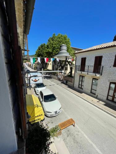 a group of cars parked on the side of a street at Arra Camere Sirolo - Rooms & Suite in Sirolo