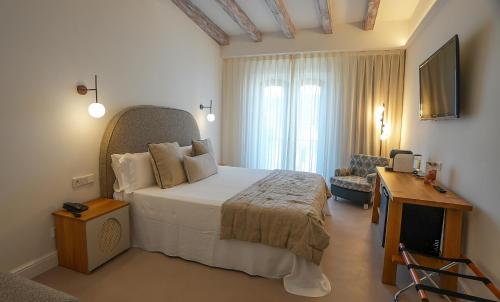 Postel nebo postele na pokoji v ubytování Hotel Spa Porto Cristo