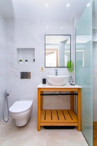a bathroom with a sink and a toilet at Emerald Malia in Malia