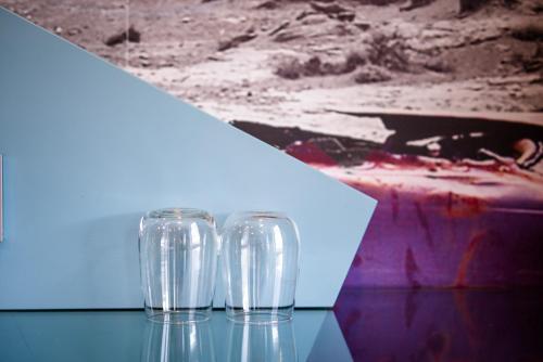 three empty glasses sitting on a table in a room at Comfort Hotel Jönköping in Jönköping