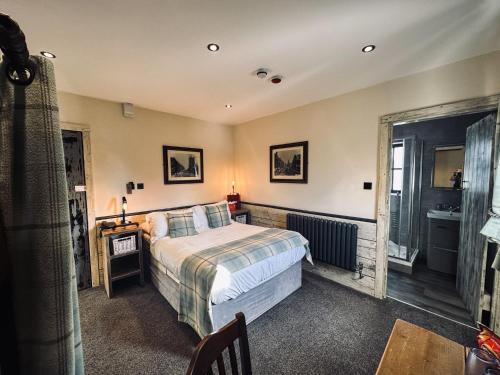 a bedroom with a bed and a window at South Causey Inn in Stanley