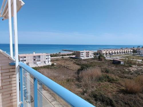 a balcony with a view of the beach and buildings at Beach,s House in Playa del Puig in La Torre