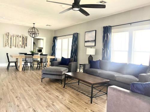 a living room with a couch and a table at Old Town Charm with 2 Bedrooms, 3 TVs in Lawton