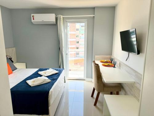 En eller flere senge i et værelse på Flat 427 confortável na Passagem à 700m da praia