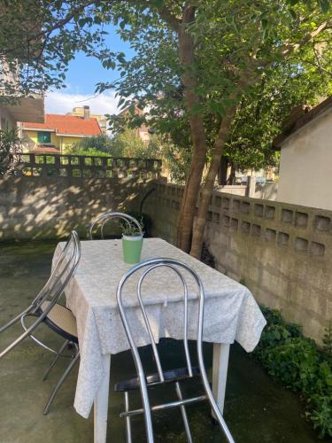 a white table with two chairs on a patio at Casa Elisa 8 in Bellaria-Igea Marina