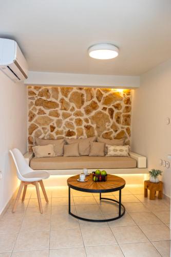 a living room with a couch and a table at Aotés in Naxos Chora