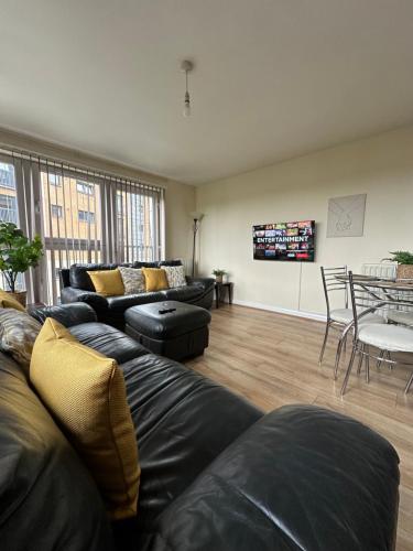 a living room with a couch and a table at Down Town Pad*2Bed&Free Parking* in Glasgow