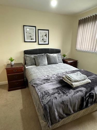 a bedroom with a large bed with two night stands at Down Town Pad*2Bed&Free Parking* in Glasgow