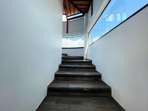 a staircase in a building with a stair case at Confortable habitación #304 in Toluca