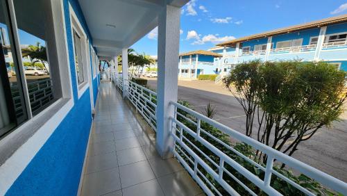 a balcony of a house with a white railing at Lacqua diRoma 1 - Apartamentos JN in Caldas Novas