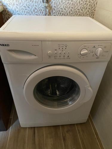 a white washer and dryer in a room at L'albero di limoni sul mare di Pizzo in Pizzo