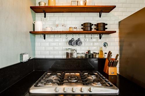a stove top oven sitting in a kitchen at Villa Sueño Azul - Playa Venao in Playa Venao