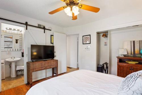 a bedroom with a bed and a flat screen tv at Trinity Escape Entire home near Lodi Lake in Lodi