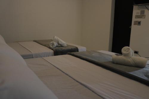 Postel nebo postele na pokoji v ubytování Hotel San Juan 70 Medellin