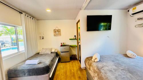 Postelja oz. postelje v sobi nastanitve Be Happy Hotel