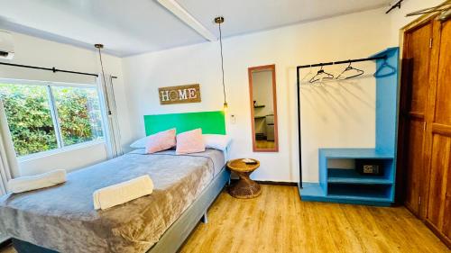 Postelja oz. postelje v sobi nastanitve Be Happy Hotel