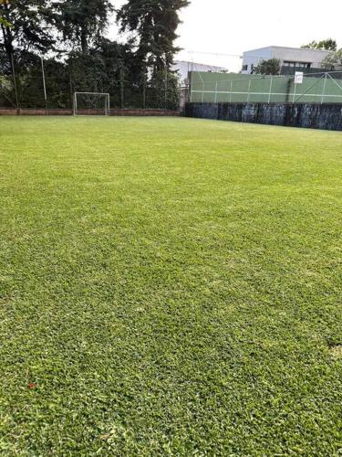 a soccer field with a soccer ball on it at Casa Villas Suizas I cerca de Laberinto de Albania in Apaneca