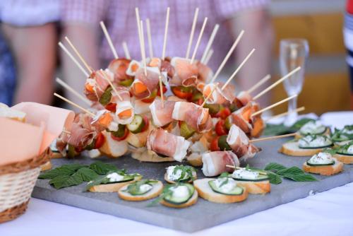 a plate of food on a table with appetizers at Der Brunnerhof in Mühlbach