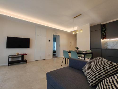 a living room with a couch and a table at Casa Maribella Cattolica in Cattolica
