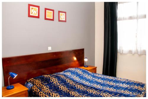 Cama o camas de una habitación en Résidence VICYMA app meublés haut standing Bafoussam