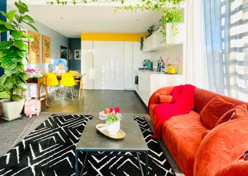 a living room with a couch and a table at Extraordinary holiday stay for Melbourne explore in Melbourne