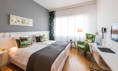Postel nebo postele na pokoji v ubytování WestCord Hotel Delft