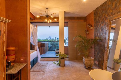 a living room with a view of the city at Iron and Stones in Rio de Janeiro