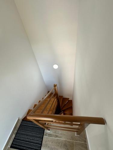 a stairwell in a room with a ceiling at Bujtina Carku in Theth