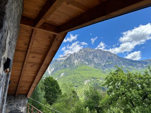a view of a mountain from a house window at Bujtina Carku in Theth