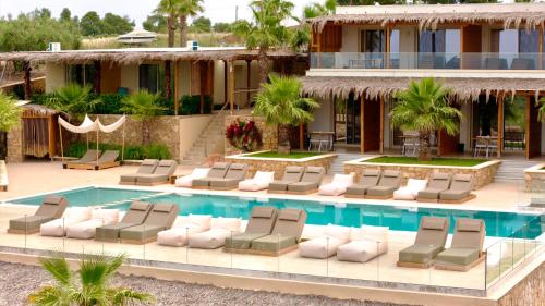 an image of a resort with a pool and lounge chairs at SANIMAR By Mono Alex in Kassandra