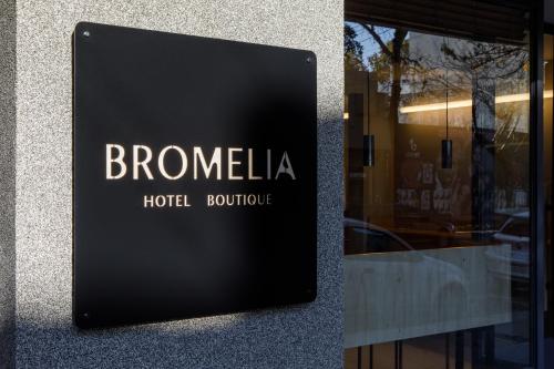 a sign on a window of a hotel boutique at Bromelia Hotel Boutique in Buenos Aires