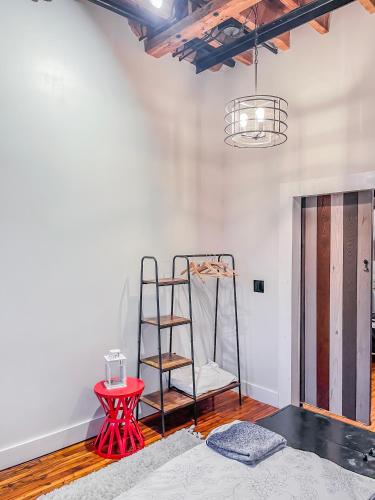 a room with a ladder and a red table at Stylish Philly Loft in Philadelphia